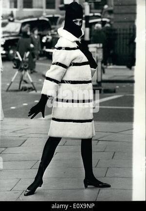 Dec. 12, 1965 - Fur Fabrics Show in London: Photo Shows This striking coat in cuddly white Courtelle, with ''barrel hoops'' in black plastic - was worn yesterday by Stella Grove at the showing in London of Fur Fabrics for 1966 - by Lister. Stock Photo