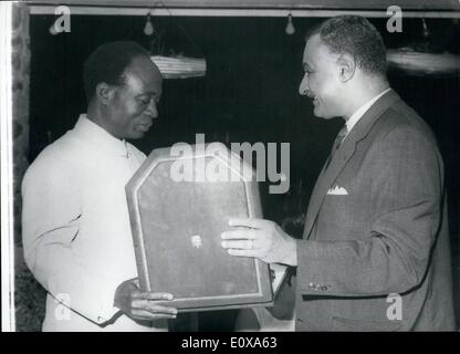 Nov. 04, 1965 - 4-11-65 Collar of the Nile for President Nkrumah from President Nasser. President Nasser of Egypt (right), seen presenting President Nkrumah of Ghana with a gold chain Collar of the Nile , at a reception held at the UAR Embassy in Accra, Ghana, in honour of President Nkrumah, and Nasser during President Nasser's State visit to Ghana. Stock Photo