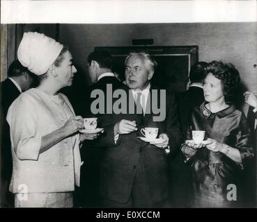 Apr. 04, 1966 - Premier meets Joan Crawford; Actress Joan Crawford and other leaders of Variety Club International - were yesterday invited to No. 10 Downing Street for afternoon tea, by the Prime Minister, Mr. Harold Wilson. Photo Shows The Prime Minister, Mr. Harold Wilson and Mrs. Wilson, chatting to Joan Crawford (left), over a cup of tea - at No. 10, Downing street yesterday. Stock Photo