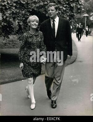 Jun. 06, 1966 - Pet Clark Opens In Savoy Cabaret Tonight: Popular singer Petula Clark, over here from France, opens in the Savoy Cabaret this evening - her first cabaret appearance in this country in about five years. Photo shows Petula Clark taking a stroll in Savoy Gardens with her husband, Claude Wolff (who is also her manager) Stock Photo