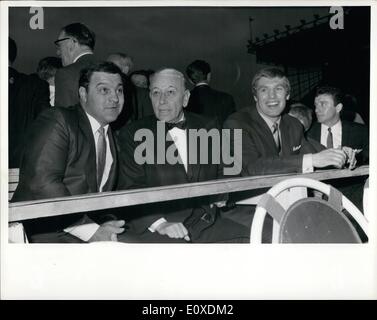 May 05, 1966 - At the Ring Side: Former World Heavyweight Champion Rocky Marciano, left, film actor George Raft, And British Heavyweight Billy Walker, right, Pictured at the ring side before the World Championship title fight between world champion Cassius Clay, and British Challenger Henry Cooper ,at Highbury stadium, London, this evening, May 21. Stock Photo