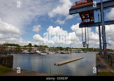 old industrial cranes in edward albert dock in Riversway Preston docklands marina England UK