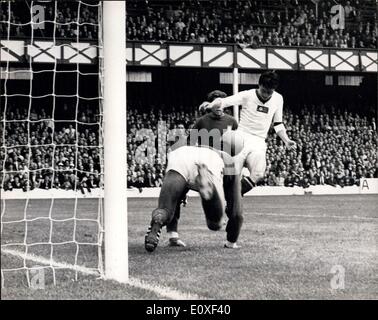 Jul. 23, 1966 - World Cup Football ? Portugal v North Korea at Sunderland. Photo Shows: Pak Doo Ik of N. Korea shoots for goal but the Portuguese goalie dives at his feet to make a fine save. Portugal won 5-3 Stock Photo