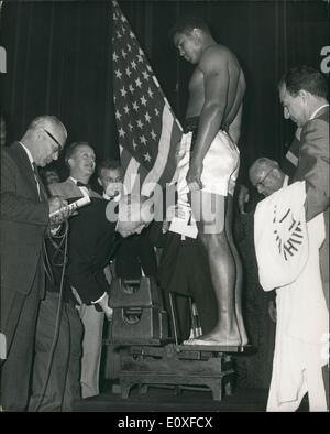 Aug. 08, 1966 - Weigh-in for Tonight's Big Fight: Muhammad Ali (Cassius Clay) , the world heavyweight champion, and Brian London, weighed in this afternoon for their title fight at Earl's Court London, tonight Photo shows Muhammad Ali (Cassius Clay) on the Oieon, Leicester Square. Stock Photo