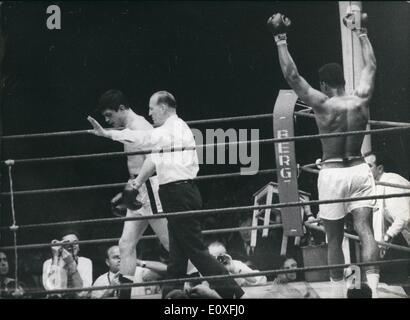 Sep. 09, 1966 - Clay wins Title Fight vs Mildenberger: Heavyweight World Champion Cassius Clay (Muhammad Ali) won the title fight held in Frankfurt today against his German challenger Karl Mildenberger with a technical ko in the 12th round. Photo shows Clay after referee declared him winner while Mildenberger (left) goes back to his corner. Stock Photo