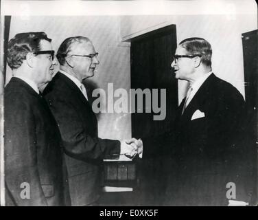 May 05, 1967 - Agreement on Tariff outs at Kennedy Round talks in Geneva: Agreement on teriff outs was reached late last night at the Kennedy Round talks in Geneva. Photo shows Handshakes in Geneva yesterday between Sir Richard Powell of the Board of Trade, leader of the British delegation, (in centre) and M. Jean Rey, leader of the Comon Market delegation (on right). Looking on, on left is Sir Eugene Melville, K.C. M.G. Ambassador to the United Nations at Geneva. Stock Photo