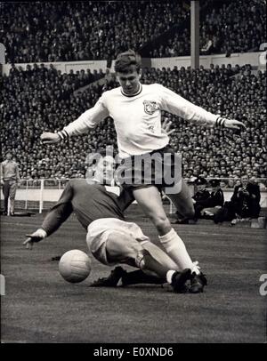 Apr. 22, 1967 - DISPOSSESSED. WEMBLEY, LONDON: A sliding tackle by Skelmersdale United's fight-back A. BERMINGHAM, stops Enfield left-back I. REID in his tracks during an attack by the London team in the Football Association Amateur Cup Final played at Wembley Stadium near London this afternoon 22nd April. The two teams played a scoreless draw after extra-time before a 75,000 crowd. The replay will be staged next Saturday at Manchester. Stock Photo
