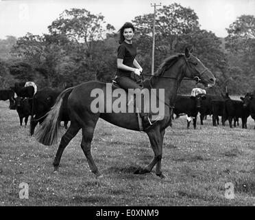 Jacqueline Kennedy horseback riding in the country Stock Photo