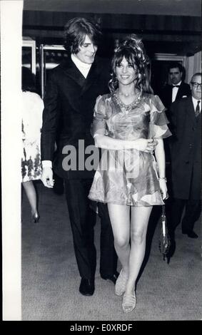 Oct. 17, 1967 - Julie Christie attends Premiere of ''Far from the madding Crowd'': Photo shows Actress Julie Christie, wearing a multi coloured mini-dress, is pictured here, escorted by Don Bessant, as she arrived at the new Odeon, Marble Aron, to attend the World premiere of her latest film ''Far From the Madding Crowd'', in which she stars with Terance Stamp. Stock Photo