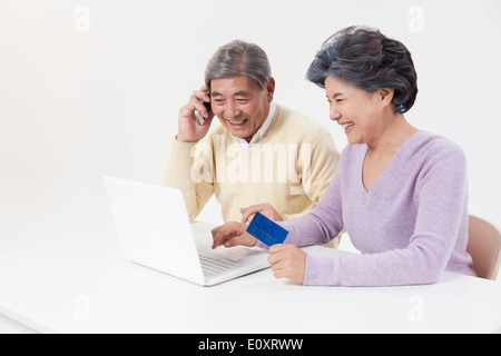 an old couple buying something online Stock Photo