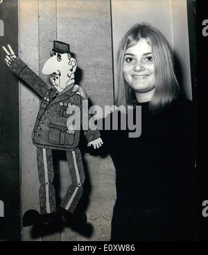 Oct. 05, 1967 - 5-10-67 De Gaulle puppet on sale in London. A cardboard cut-out of President De Gaulle, pictured at Harrod's store in London today, where they can be bought for 8/-. Other puppets which have been devised by London advertising partners, Barry Elphick and Geoffrey Charlton Perrin, are of Prime Minister Harold Wilson, and President Johnson. You buy the puppet on a large cardboard poster, cut him out, give him joints of paper clips, string him up and then make him dance to your tune. Stock Photo