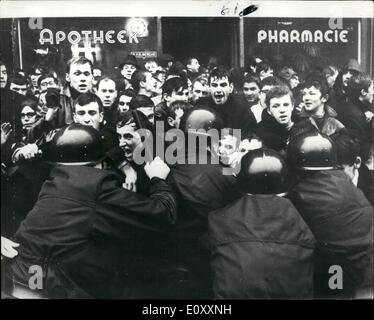 Jan. 01, 1968 - Students Riot In Louvain.: Flemish and French speaking Belgians are again at each other' s throats. Flemish students at the ancient Catholic university of Louvain take violent exception to the introduction of French into some of the faculties. Louvain, they claim, is Flemish soil; and the university therefore must be maintained as a Flemish preserve. French speaking students and staff should emigrate to Wallonie. Police and Clergy (behind the scene) have yet to find a solution to this new twist of the aged-old feud. Photo shows a clash between students and police at Louvain. Stock Photo