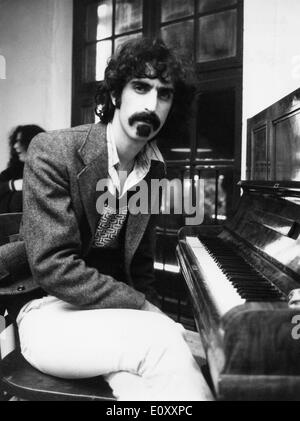 Musician Frank Zappa seated at a piano Stock Photo
