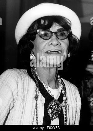 French fashion designer Coco Chanel poses with Stanley Marcus, left ...