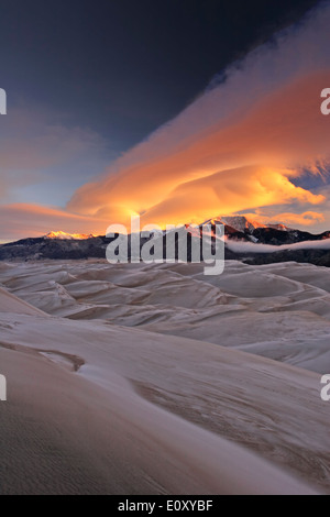 Morning clouds over sand dunes and Sangre de Cristo Mountains, Great Sand Dunes National Park, Colorado USA Stock Photo