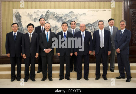 (140520) -- BEIJING, May 20, 2014 (Xinhua) -- Chinese Vice Premier Wang Yang (C, front) meets with a Brazilian delegation headed by Cesar Borges (3rd R, front), Brazil's Minister of State for Transport, and Luciano Coutinho (3rd L, front), president of the Brazilian National Development Bank (BNDES), in Beijing, capital of China, May 20, 2014.  (Xinhua/Xie Huanchi) (zc) Stock Photo