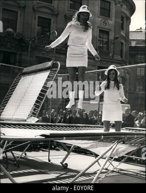 May 05, 1968 - EDWARD HEATH OPENS BRITAIN'S THIRTEENTH DAIRY FESTIVAL OUTSIDE THE ROYAL EXCHANGE: Mr. Edward Heath, Leader of the Opposition, today opened Britain's thirteenth Dairy Festival outside the Royal Exchange in the City. The theme THE DAIRY FESTIVAL - FUN FOR THE FAMILY. Photo shows Two of the milk-maids, Sheila Corsaw, of Hampstead (left) and Margaret Robson , of Wimbledon, try out the trampoline on display at the festival outside the Royal Exchange. Stock Photo