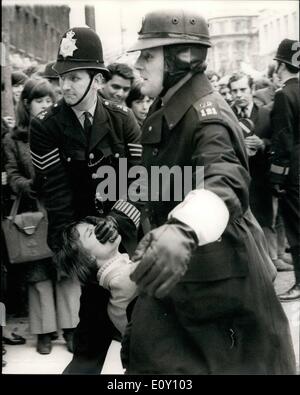 Mar. 03, 1968 - Youth Campaign For Nuclear Disarmament Stage Anti-Vietnam War Demonstration: The Youth Campaign for Nuclear Disarmament today staged an anti-Vietnam war demonstration in Trafalgar Square, followed by a march to Downing Street where petitions were handed in to No. 10. Photo shows A police officer clamps his hand over the mouth of one of the demonstrators as he is dragged away in Whitehall today. Stock Photo