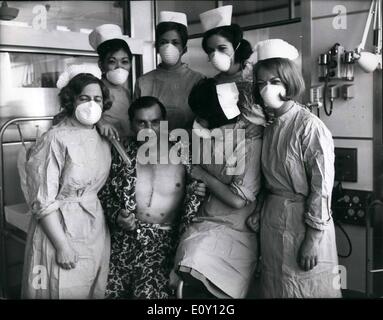 May 05, 1968 - First move for heart transplant patient; Britain's first heart transplant patient, Mr. Frederick West, 45, baring his stitched up chest poses with his team of nurses in his special hospital suite at the National Heart Hospital, Marylebone, London, today. Mr. West was yesterday moved from the sterile theater where the operation took place 24 days ago to the equally sterile suite. Mr. West, of from Leign-on-Sea, received the heart of Irish born carpenter Mr .Patrick Ryan, 26, who died following a fall from a London building site. Stock Photo