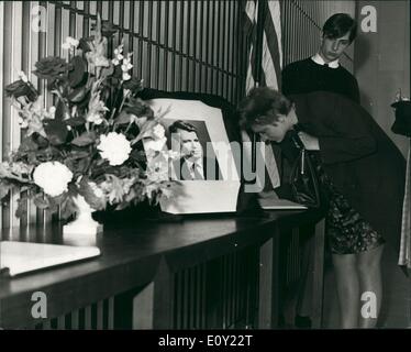 Jun. 06, 1968 - Death of Senator Robert Kennedy Scene In London: Senator Robert Kennedy died today at the Goo Samaritan Hospital in Los Angeles, 25 hours after being shot by a gunman. Photo shows A book pf condolences being signed at the American Embassy in London today. Stock Photo