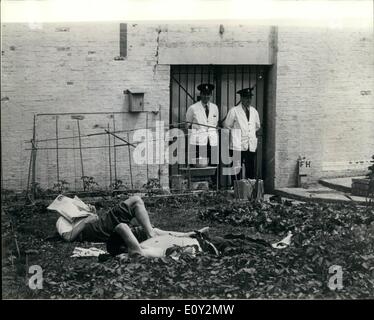 Jun. 06, 1968 - Inside Britain's toughest jails - the Maximum security wing at Durham Prison.: One of a series of pictures taken during a press visit to the maximum security wing of Durham Prison, where some of Britain's most closely guarded long-term prisoners are serving sentences for the Great Train Robbery, for espionage, for murder and crimes of violence. Photo shows a break in the sunshine for these prisoners as they sunbathe during a break from tending their vegetable plot at Parkhurst Jail, Isle of Wight. Stock Photo