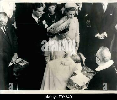 Jun. 26, 1968 - June 26th 1968 Danish Royal christening in Copenhagen. The baby son of Princess Margrethe and Prince Henrik of Denmark was christened at Holomens Church in Copenhagen on Monday June 24th. The baby was christened, Frederik Andre Henrik Christian. Photo Shows: Princess Margrethe holds her baby son as Bishop Jensen performs the christening ceremony. Looking on (L to R) King Frederik, Prince Henrik, Countess Andre de Monpezat and Queen Ann-Marie of Greece. Stock Photo