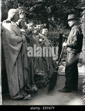 Oct. 10, 1968 - Statues from Houses of Parliament to be Sold.: Photo Shows Mr. John Lyons, a gardener at the Palace of Westminster, looking at some of the stone statuettes which are to be sold by tender by the Ministry of Public Building and Works. The Statuettes, mostly unidentified Saxon Kings and Queens, have been removed during rebuilding and renovation from the exterior of the House of Parliament. Stock Photo