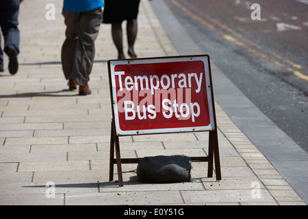 temporary bus stop sign on a city street in Preston England UK Stock Photo