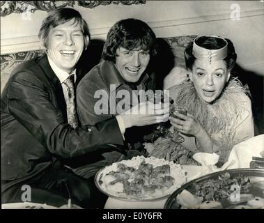 Mar. 03, 1969 - Judy Garland weds 47 year old singer and actress Judy Garland was married today at the Chelsea Registry Office to 35 year old New York businessman Mickey Deans. The best man was American Pop singer Johnny Ray. Photo shows seen toasting the bride Judy Garland are left the best man Johnny Ray, and the groom during the wedding reception at Quaglino's this afternoon. Stock Photo