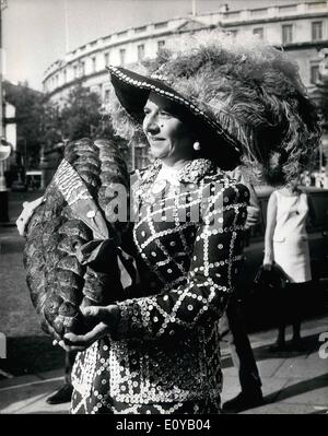 Oct. 05, 1969 - October 5th, 1969 The Pearlies Harvest Festival at St. Martins-in-the-Fields. The Pearly Kings and Queens held their Annual Harvest Festival and service at St. Martins-in-the-Fields, Trafalgar Square, today. Photo Shows: The Pearly Queen at Finsbury, Mrs. Marie Marriott, arriving for the Harvest Festival carrying a giant loaf of bread. Stock Photo