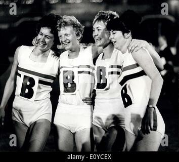 Aug. 13, 1969 - Athletics at White City Great britain Vs. United States - Photo Shows:- The Triumphant British team after winning the Women's 4 x 400 M. Relay during the Great Britain Vs. United States Athletics Match at WHite City, London, last night. They are, from left: B. Lyall; P. Lowe; L. Board and J. Simpson. Stock Photo