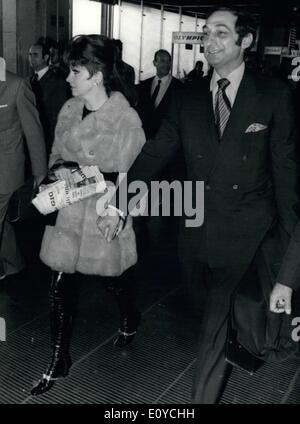 Nov. 11, 1969 - Gina Lollobrigida, the beautiful Italian star, left Rome to New York. accompanied by the american businessman George Kauffman, 35. They will get marriage as soon they will arrive in New York. Photo shows Gina and George Kauffman at Fiumicino Airtp. Stock Photo