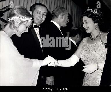 Nov. 25, 1969 - The Queen Attends Premiere: H.M. The Queen, shakes hands with British-born girl singer Petula Clark, as Her Majesty arrived at the Empire Cinema, Leicester Square, London, last night, to attend the premiere of the film ''Goodbye, Mr. Chips'', in which Petula Clark stars. The Queen was accompanied by Admiral of the Fleet Earl Mountbatten. The performance was in aid of the Save The Children Fund, of which the Queen is patron. Stock Photo