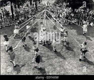 Jun. 10, 1970 - Festival Of Singing Games: Boys and girls from infants' schools all over London are taking part in the annual Festival of Singing Games, which this year is being spread over three days, at the Redriff primary school in Rotherhithe. Photo shows Children look on during a display of maypole dancing by Redriff juniors - during the annual Festival of Sing Games today. Stock Photo