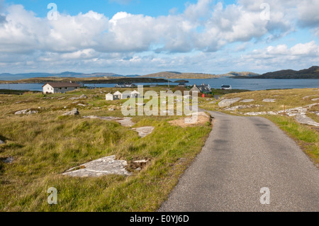 The single-track road into the village of Bruernish on the island of Barra in the Outer Hebrides. Stock Photo