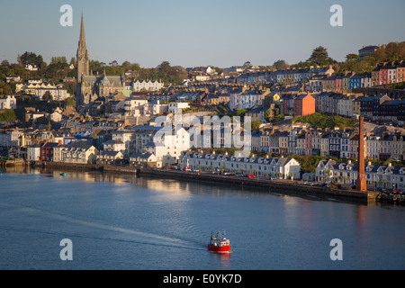 Fishing boat headed out to sea at dawn, Cobh, County Cork, Ireland Stock Photo