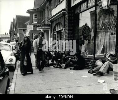 Aug. 08, 1970 - Pop Fans invade the Isle of Wight for the pop music festival at freshwater: Photo Shows Some of the pop fans sitting on the pavements outside shops in the village of Freshwater. The local are protesting strongly about this. Stock Photo