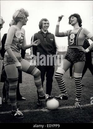 Mar. 01, 1971 - The World's Most Beautiful Football Match.: The world's most beautiful football match presented by Jon, Marc & Paul, hairdressers - took place yesterday at Hurlingham Stadium between the Lumley Lovers and The Robinson Ravers - two teams of beautiful girls from rival model agencies Peter Lumley and G'avin Robinson. The match was in aid of charity. Photo shows The two captains tossing up before the match, watched by the referee, Arsenal footballer Bob McNab. Stock Photo