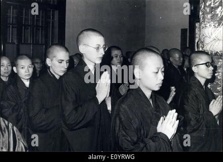 Apr. 27, 1971 - U.S. Women become Buddhist Nuns: Two young American women become Buddhist Nuns after having their heads shaved for the initiation ceremony at a Buddhist temple in Taipei, Taiwan, as they pray with a group of Chinese Nuns undergoing the ceremony of vows to follow the teaching of Buddha. The noviates are second and third from the right in the front line. Stock Photo