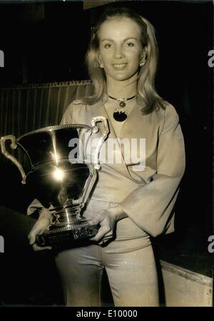 Dec. 14, 1971 - Marie Claude Beaumont won the 1971 Tour de France Automobile and stands with her trophy. Stock Photo