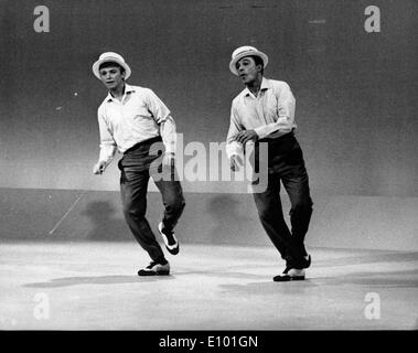 Gene Kelly and Tommy Steele practice for TV Stock Photo