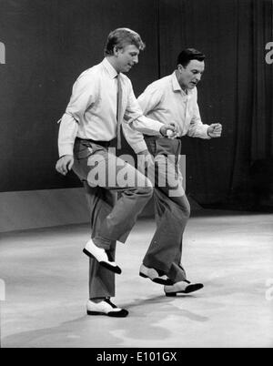 Gene Kelly and Tommy Steel rehearse for TV Stock Photo