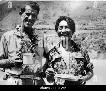 Climbers Edmund Hillary and Sherpa Tenzing Norgay of the British Everest Expedition celebrate after being the first people to summit Everest 1953. Stock Photo