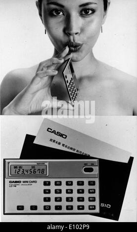 Model displays slim business card sized Casio calculator designed