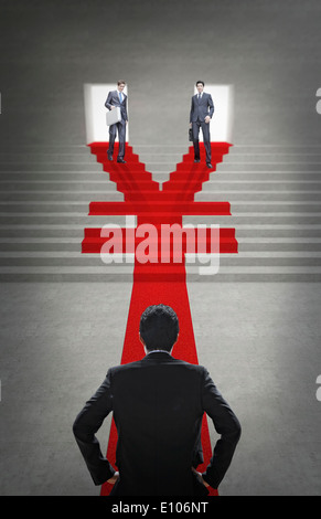 two business men walking down a Yuan shape staircase Stock Photo
