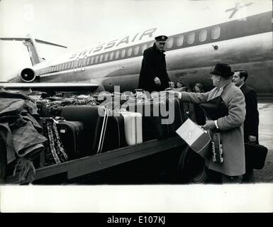 Feb. 02, 1970 - AIRLINER PRECAUTIONS: A passenger identifying his luggage before boarding a Zurich-bound airliner at Heathrow Airport yesterday. As a precaution against the possibility of bombs being smuggled aboard, all Passengers had to make a last-minute check. Unidentified luggage would have been left behind. Stock Photo