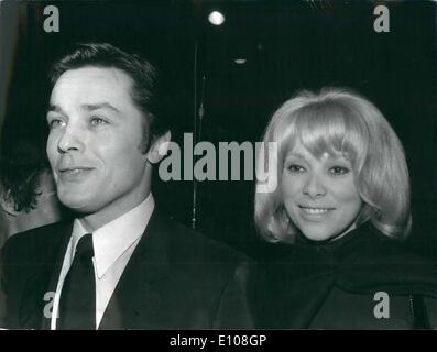 Mar. 03, 1970 - Alain Delon producer actor at Premiere of a ''Borsalino:; The premiere of ''Borsalino'', a film starring Alain Delon and produced by the actor was held at the opera paramount, Paris. last night. Co-starring with Delon is his former friend and now enemy Jean Paul Belmondo. The latter claiming that Delon reserved for himself a Lion's share of publicity is reported to be sueing his former friend. The film depicts Marseilles underworld in the early thirties. Photo Shows Alain Delon pictured with Mireille Darc his partner in the Film during the premier last night. Stock Photo