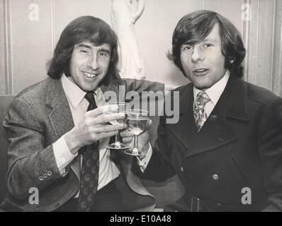 Film Director Roman Polanski toasts with driver Jackie Stewart Stock Photo