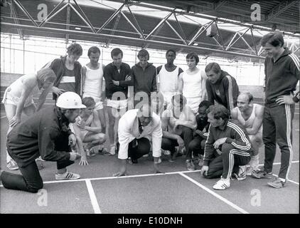 May 05, 1972 - Jesse Owens, four time winner of an Olympic Gold medal visits Munich: Jesse Owens, seen here demonstrating a perfect start to young German sportsmen, has come to Munich to be the leading actor in some advertising spots of an American firm, which are being shot at the Olympic site. This is of course a good chance for the 58 year old Jesse Owens, who won 4 gold medals at the Olympic Games in Berlin 1936, to have a look around the Olympic site here in Munich. Stock Photo