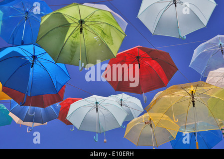 Umbrellas hanging from wires in Pai, Thailand Stock Photo